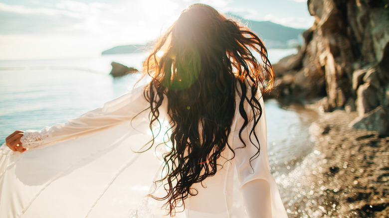 woman walking on beach