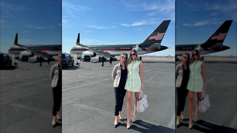Margo Martin posing with Meredith O'Rourke in front of Trump's plane