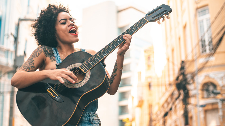 musician sings outside