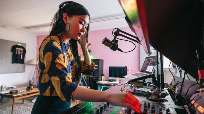 woman DJs at home