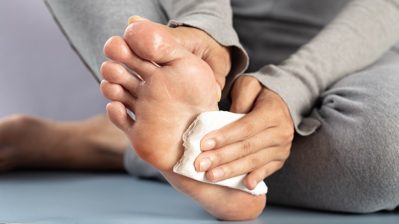 Woman wiping her feet