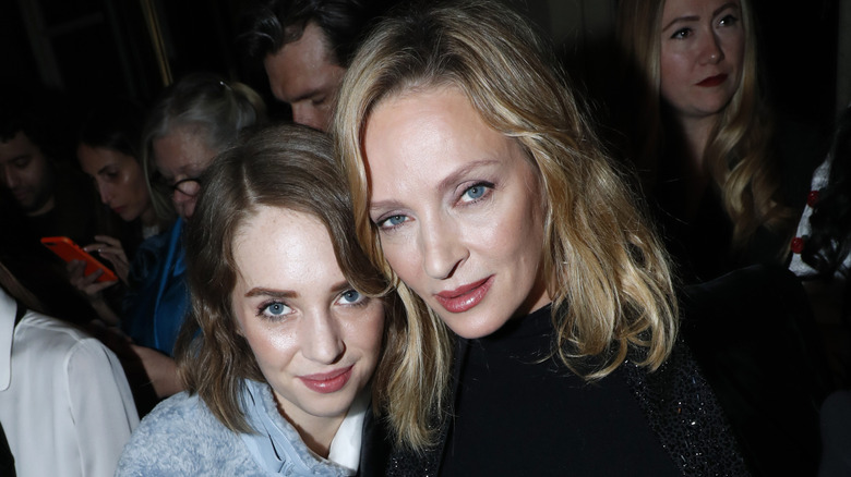 Mother-daughter duo Maya Hawke and Uma Thurman posing together at a 2019 fashion event