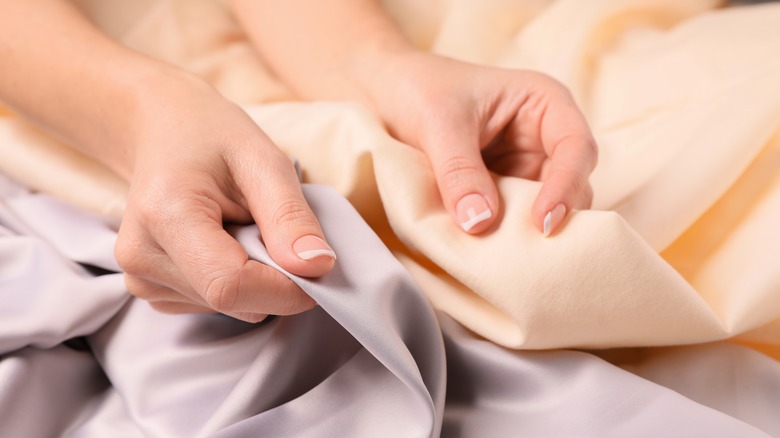 Woman touching fabrics