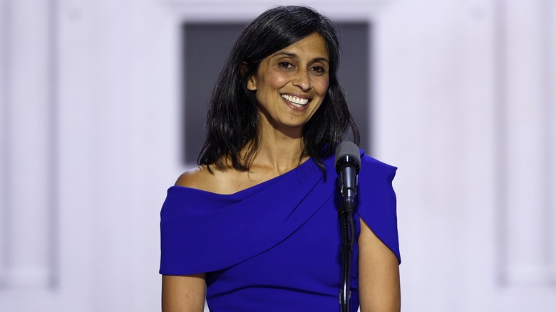 Usha Vance smiling in a blue dress
