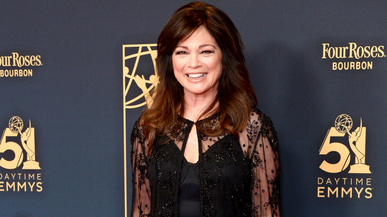 Valerie Bertinelli in a black dress on the red carpet with brown hair