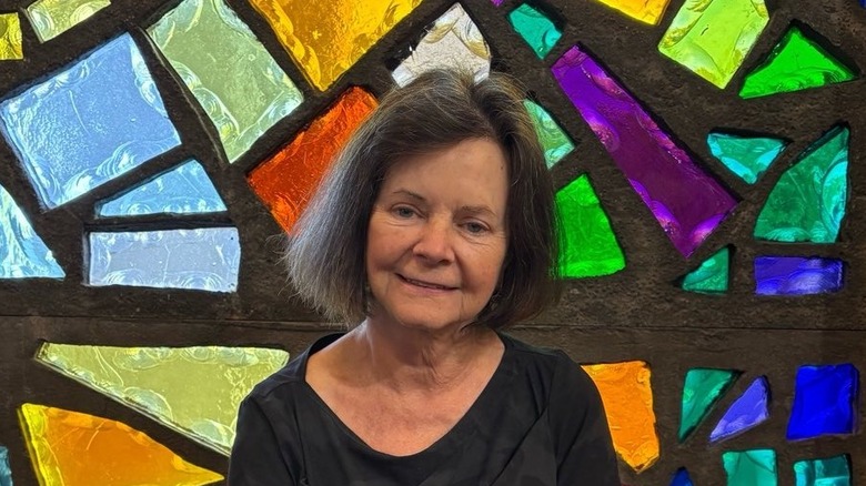 Geraldine Brooks in front of a stained glass window