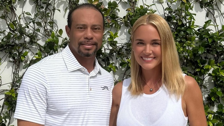 Tiger Woods posing with Vanessa Trump