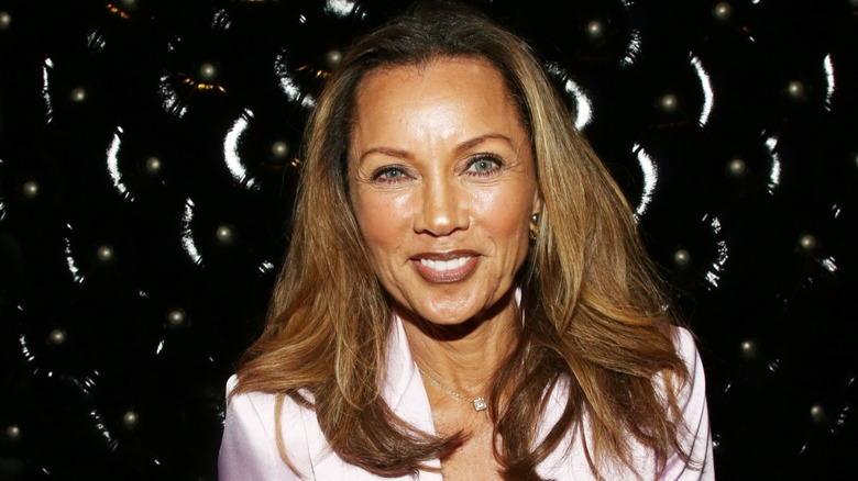 Vanessa Williams smiling in front of a black bacground