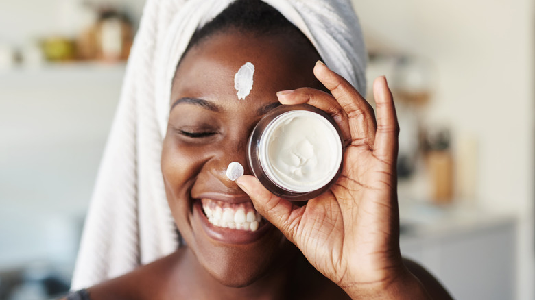 Woman applying skincare