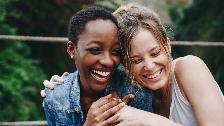 Two friends hugging 