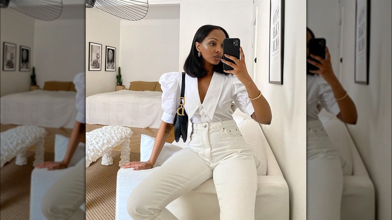 Woman in high-waisted white pants