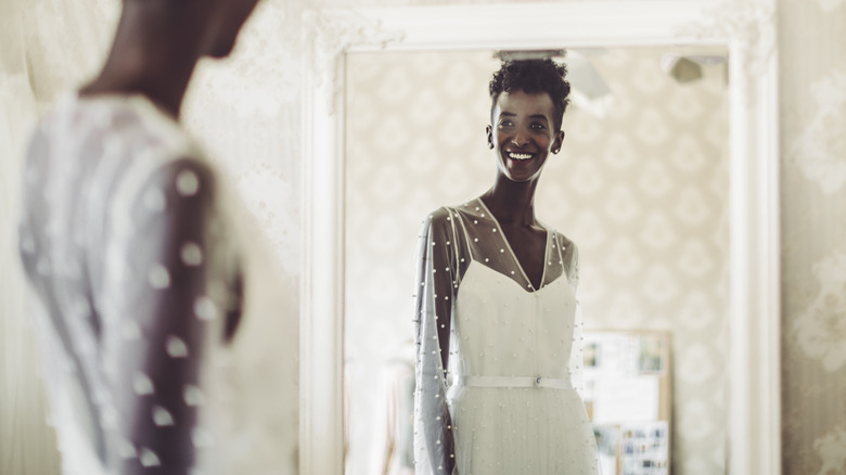 Wearing wedding dress