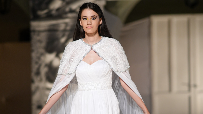 Wearing wedding cape