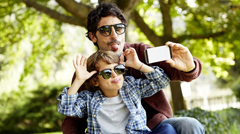 Man playing with child
