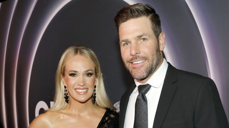 Carrie Underwood and Mike Fisher on the red carpet in 2025