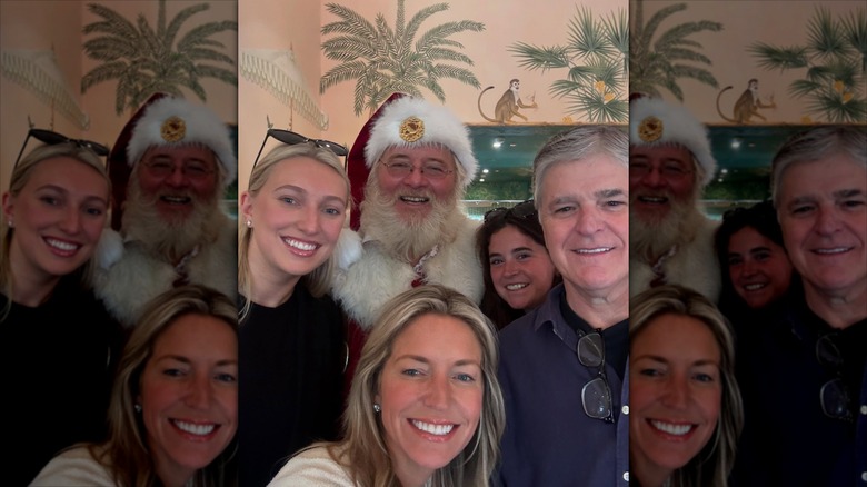 Sean Hannity, Ainsley Earhardt and family posing with Santa