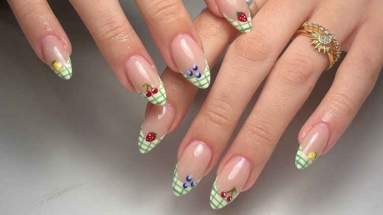 Woman with picnic nail manicure