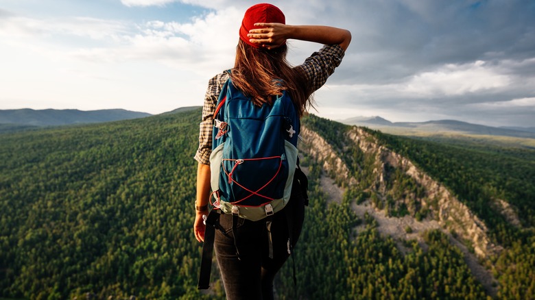 The back of a woman on a hike