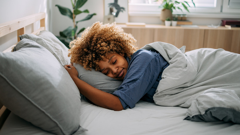Woman sleeping in bed