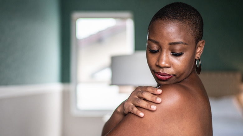 Woman appreciating skin