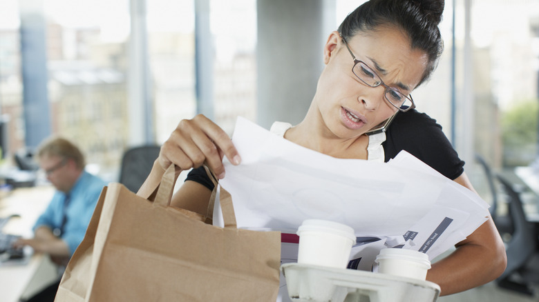 Woman being overwhelmed with workload