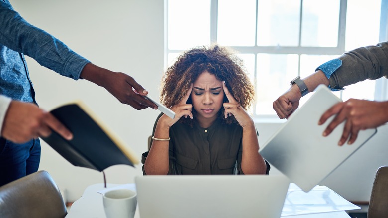 Woman with too many work demands