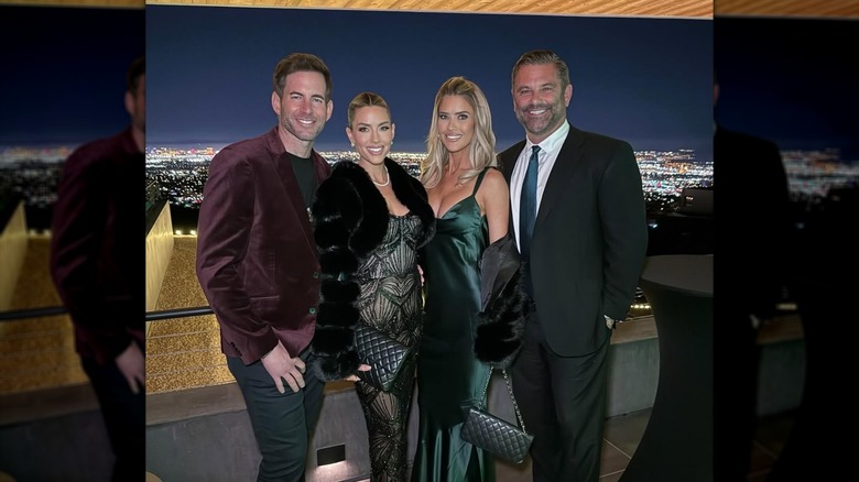 Tarek and Heather Rae El Moussa with Christina Haack and her partner, standing together outside
