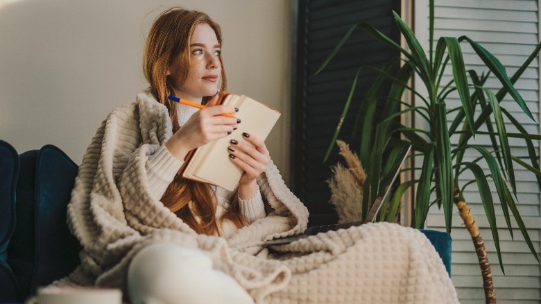 Woman writing in journal