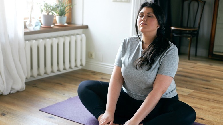 Woman stretching and breathing