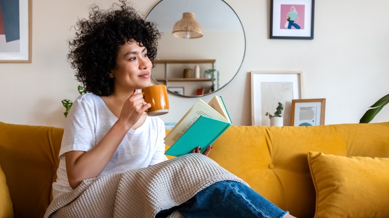 Woman having tea and reading