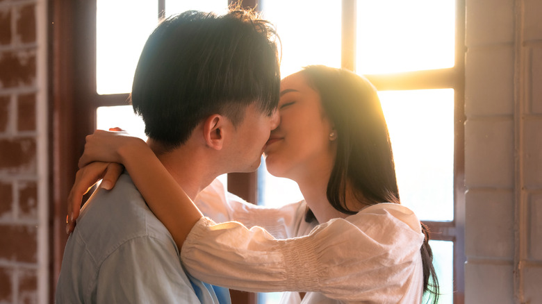 A couple kissing 