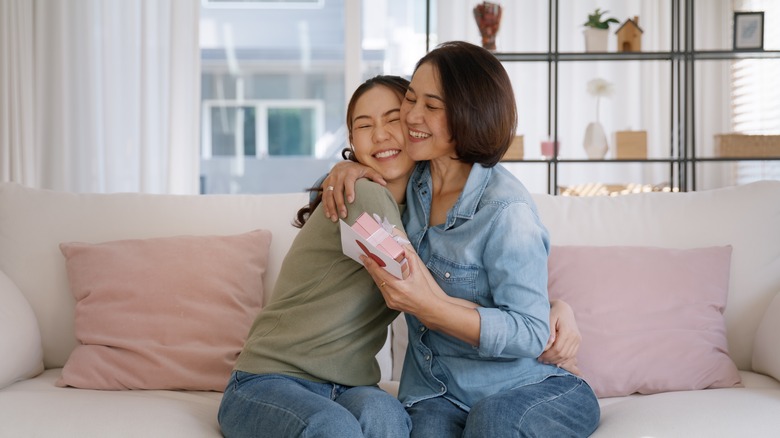 woman hugging mother