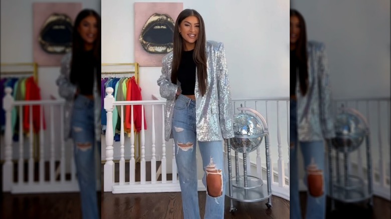 Woman wearing black T-shirt with sequin blazer