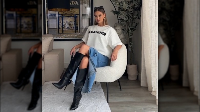 Woman wearing white T-shirt with stiletto boots