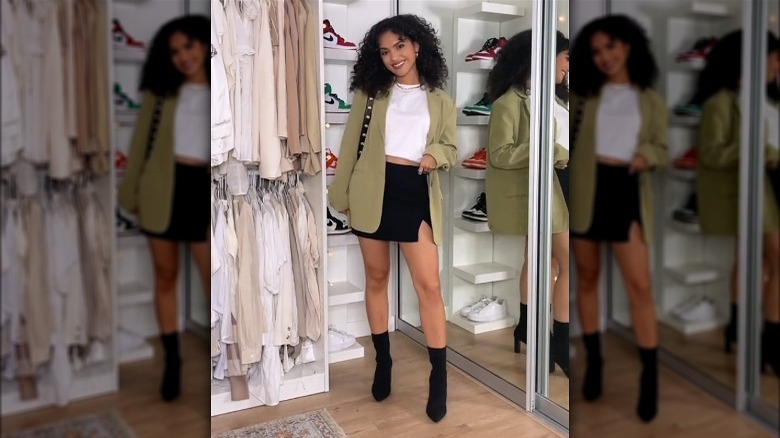 Woman wearing white T-shirt and mini skirt outfit