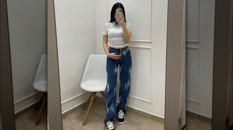 Woman wearing sheer white T-shirt