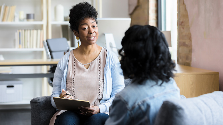 Therapist and patient in office