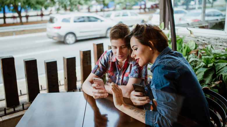 Couple looking at phone together