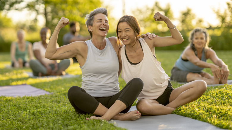 People doing yoga at park