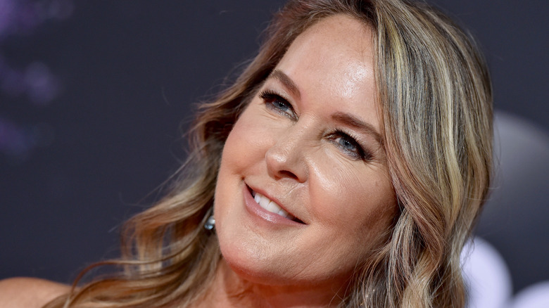 Erin Murphy smiles on the red carpet in 2019