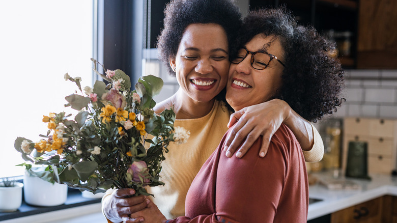 Women holding flowers