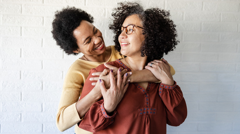 Two women cuddling 