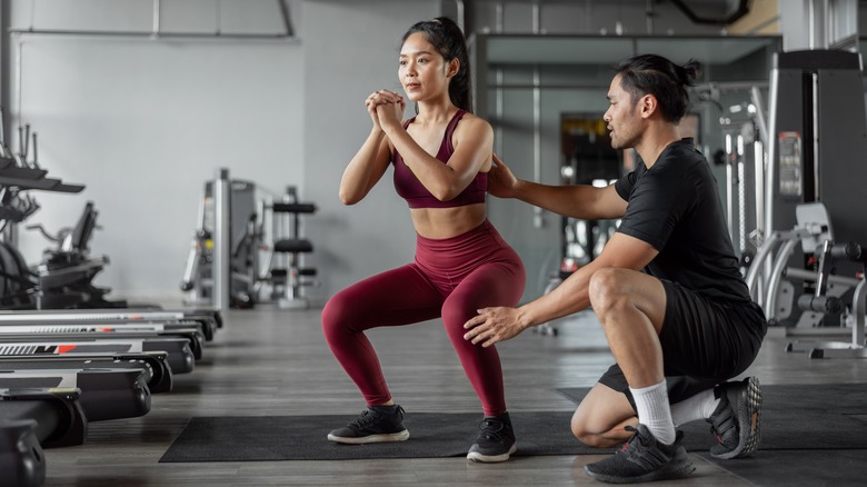 Trainer and client at gym