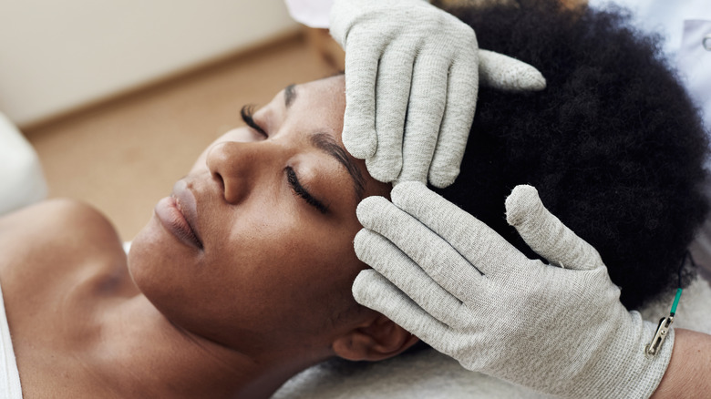 Woman getting face massage