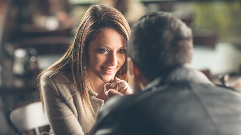 woman stares into her date's eyes