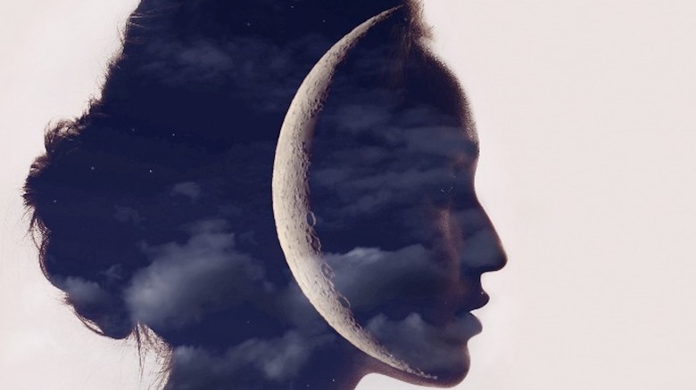 Side profile of a woman overlayed with crescent moon