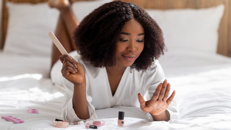 Woman doing manicure