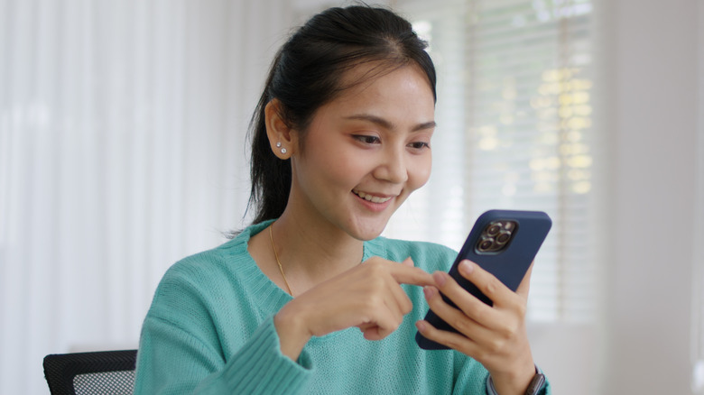 Woman scrolling on her phone