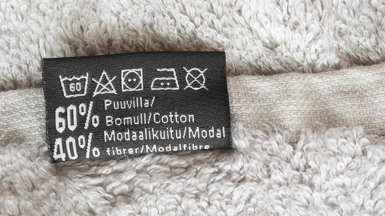 Close-up of a tag on a towel, showing the product is made with 40% modal