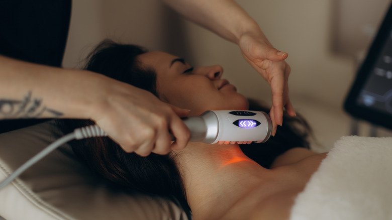 Woman getting neck treatment